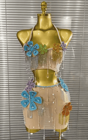 Shine in the Patti colorful rhinestone and pearl two-piece set with a sheer top and mini skirt. Perfect for parties, birthdays, and nightlife.