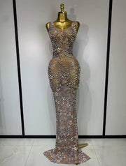 Eniola sheer mesh long dress encrusted with luxury diamonds for a high-fashion, see-through evening look.