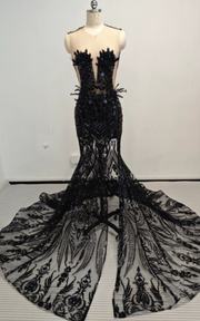 Black beaded sweetheart mermaid prom gown with fitted silhouette and flared hem