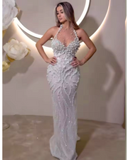 white mesh halter dress with pearl embellishments, styled for elegant evenings and bridal-inspired events.