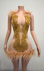 Sparkly gold mini birthday dress with a fitted silhouette for birthday parties and celebrations.