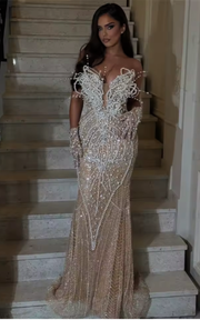 Dark champagne beaded mermaid prom dress with shimmering beadwork and elegant floor-length design.