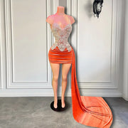 Mannequin Wearing an Orange Velvet Beaded Birthday Dress with Side Train and Sparkling Embellishments, Styled for Glamorous Celebrations