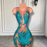 Mannequin Wearing a Sexy Blue Sheer Birthday Dress with Sparkling Crystal Embellishments, Styled for Daring Celebrations