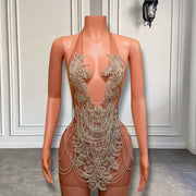 Mannequin dressed in a luxury crystal halter mini dress with hand-embellished rhinestones, perfect for birthday celebrations and special occasions