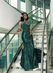 Green glitter beaded rhinestone mermaid prom dress with shimmering details.