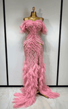 Elegant pink mesh evening gown with soft flowing fabric and feminine silhouette