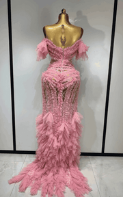 Elegant pink mesh evening gown with soft flowing fabric and feminine silhouette