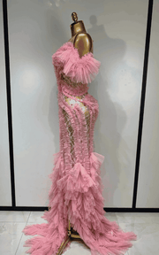 Elegant pink mesh evening gown with soft flowing fabric and feminine silhouette