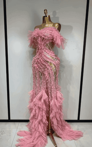 Elegant pink mesh evening gown with soft flowing fabric and feminine silhouette