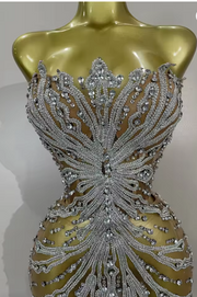 Tamara strapless see-through mini dress encrusted with shining diamonds and crystals for a luxury party look.