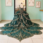 Emerald Green Quinceañera Ball Gown with Gold Applique Bow