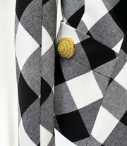 women’s blazer in black and white checkered pattern with buckle