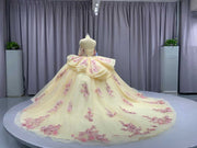 Champagne off shoulder sweetheart gown with appliqué detailing.