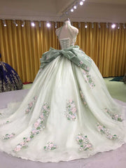 Sage green quinceañera dress with 3D handmade flower appliques for milestone celebration styling