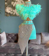 Mannequin Wearing an Elegant Feathered Cocktail Birthday Dress with Soft Plumes and Sleek Silhouette, Styled for Luxe Celebrations