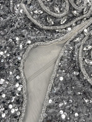 Amara one-shoulder gray sequin gown with feather details, elegant long evening dress for parties and formal occasions.