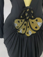 Deep V neck long sleeve bodycon maxi dress in a sleek, elegant style for evening and cocktail events