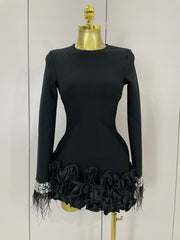 Nicole shiny diamond feather long-sleeve bodycon dress with sparkling crystals and elegant feather cuffs.