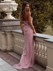 Alessia pink strapless mermaid dress with pearl beading, floral appliqué, and high split, styled for formal events and glamorous occasions.