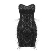 Black strapless mini dress with pearl chains, sequins, feathers, and geometric embellishments for homecoming, cocktail, and evening parties.