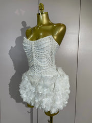 Kelsey white off-shoulder bandage mini dress with pearl chain accents and three-dimensional floral embellishments