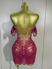 Turn heads in the Kyle rhinestone sequin off-the-shoulder mesh mini dress. Elegant party dress for birthdays, cocktail parties, and special events.