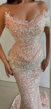 Elegant sequin mermaid prom dress with floor-length design and sparkling details.