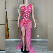 Makayla sleeveless prom dress with rhinestone flower details.
