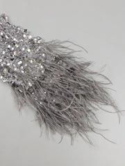 Amara one-shoulder gray sequin gown with feather details, elegant long evening dress for parties and formal occasions.