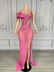 Elegant formal prom dress with sparkling rhinestones and a tasteful high split. Maya luxury evening gown.