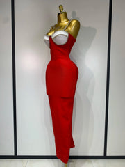 Red backless bodycon maxi dress with diamond embellishments.