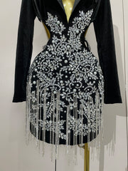 Naomi black hollow-out mini dress with diamond accents and tassels for women’s evening parties, birthdays, or stage events.