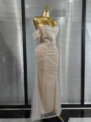 Yvonne strapless sequin beaded mermaid gown for women. Elegant bodycon dress for parties, weddings, and evening events.