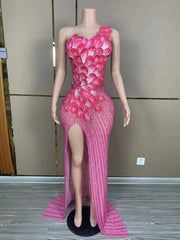 Makayla sleeveless prom dress with rhinestone flower details.