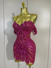 Turn heads in the Kyle rhinestone sequin off-the-shoulder mesh mini dress. Elegant party dress for birthdays, cocktail parties, and special events.