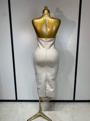 Cloe sleeveless backless bandage midi dress featuring decorative tassel details and a fitted bodycon silhouette