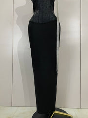 Black strapless bodycon bandage dress with sparkly diamond embellishments and tassel details for women’s party and birthday wear.