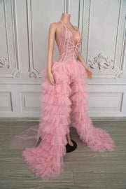 Tiana pink sheer rhinestone prom dress with deep V-neck and sparkling details.