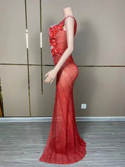 Makayla sleeveless prom dress with rhinestone flower details.