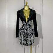 Naomi black hollow-out mini dress with diamond accents and tassels for women’s evening parties, birthdays, or stage events.