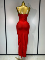 Red backless bodycon maxi dress with diamond embellishments.