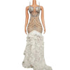 Tiana sparkly long prom dress with rhinestones, pearls, and feather details.