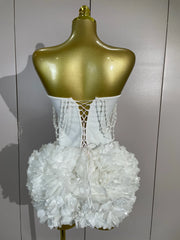 Kelsey white off-shoulder bandage mini dress with pearl chain accents and three-dimensional floral embellishments