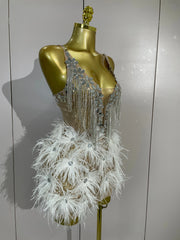 Angeli sheer mesh mini dress featuring sparkling rhinestones, decorative chains, mirror-like accents, and feather details