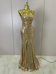 Alana gold strapless ruched backless maxi gown for women. Elegant dress for weddings, prom, birthdays, and evening parties.
