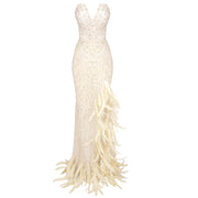 Selah nude strapless crystal embellished gown with feathers and high side slit – elegant sheath dress for homecoming, prom, and glamorous evening events.