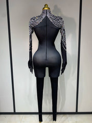 Audre luxury rhinestone stretch jumpsuit with shimmering rhinestones and fitted silhouette.