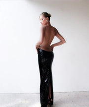Soraya Black sequin luxury gown with structured bodice and flowing silhouette, styled for formal parties and glamorous occasions.