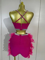 Margie two-piece party set featuring a beaded crop top and feather skirt for a glamorous statement look